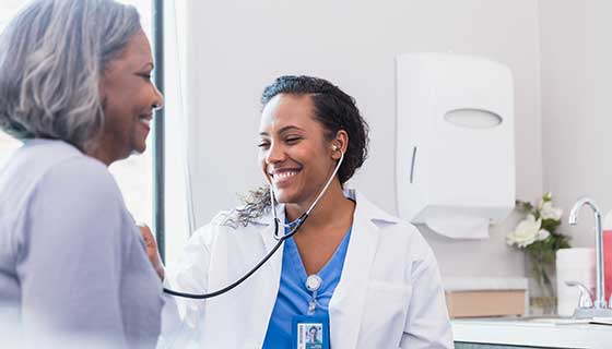 Cardiologist listens to a patients' stethoscope
