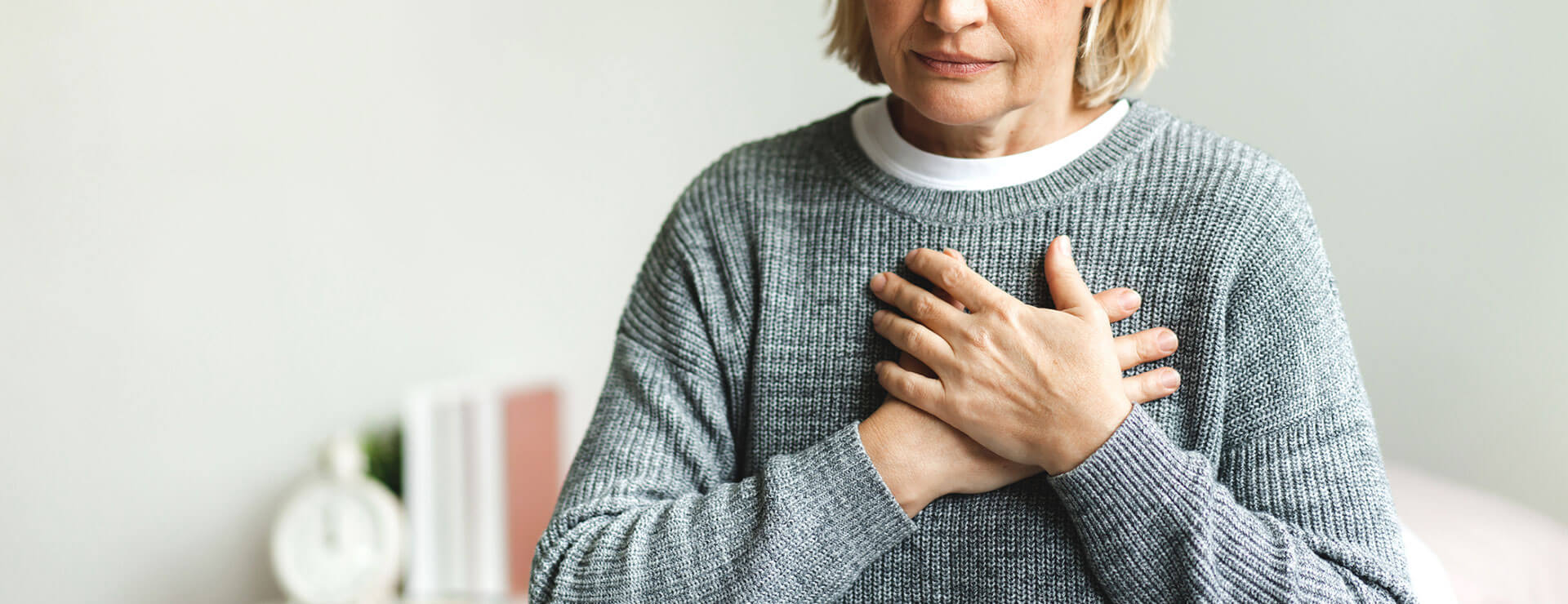 hands held over heart