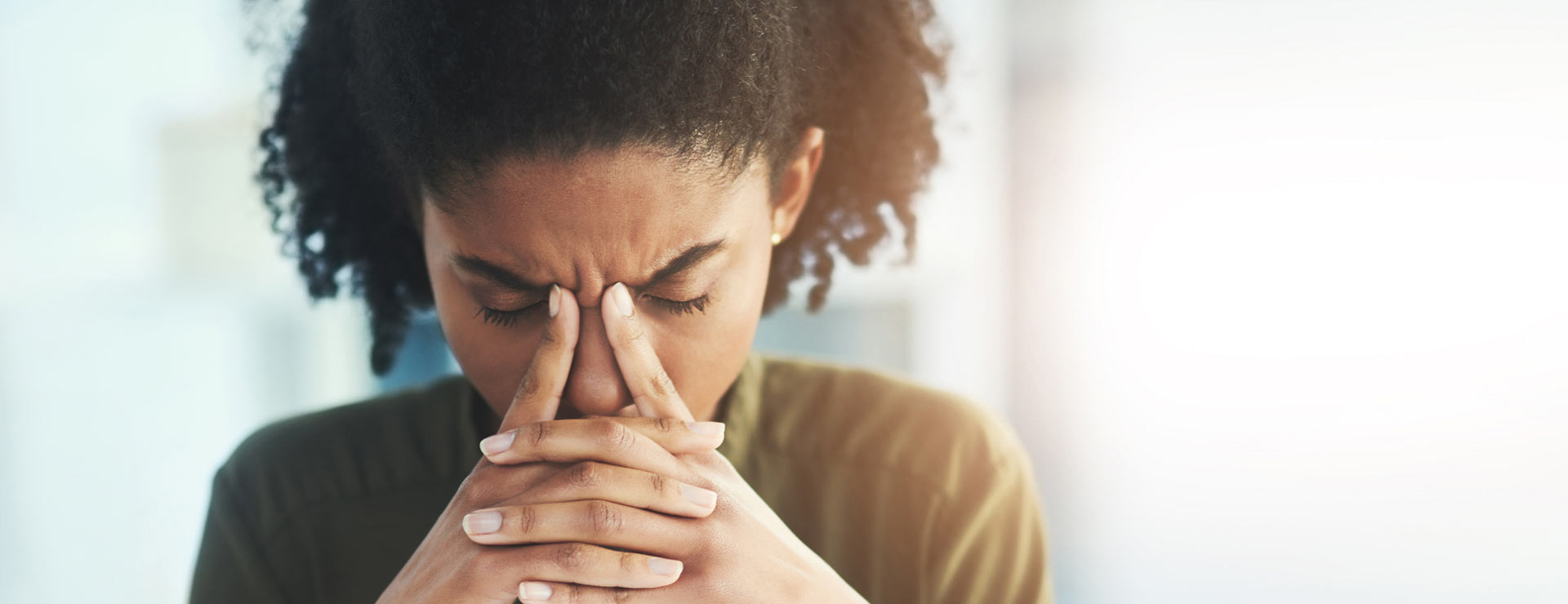 Woman with a severe headache or migraine
