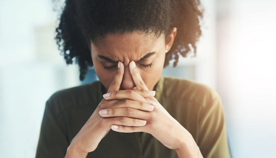 Woman with a severe headache or migraine