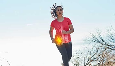 Jogger running outside with x-ray overlay over hip.