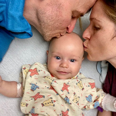 camden's parents kissing his forehead