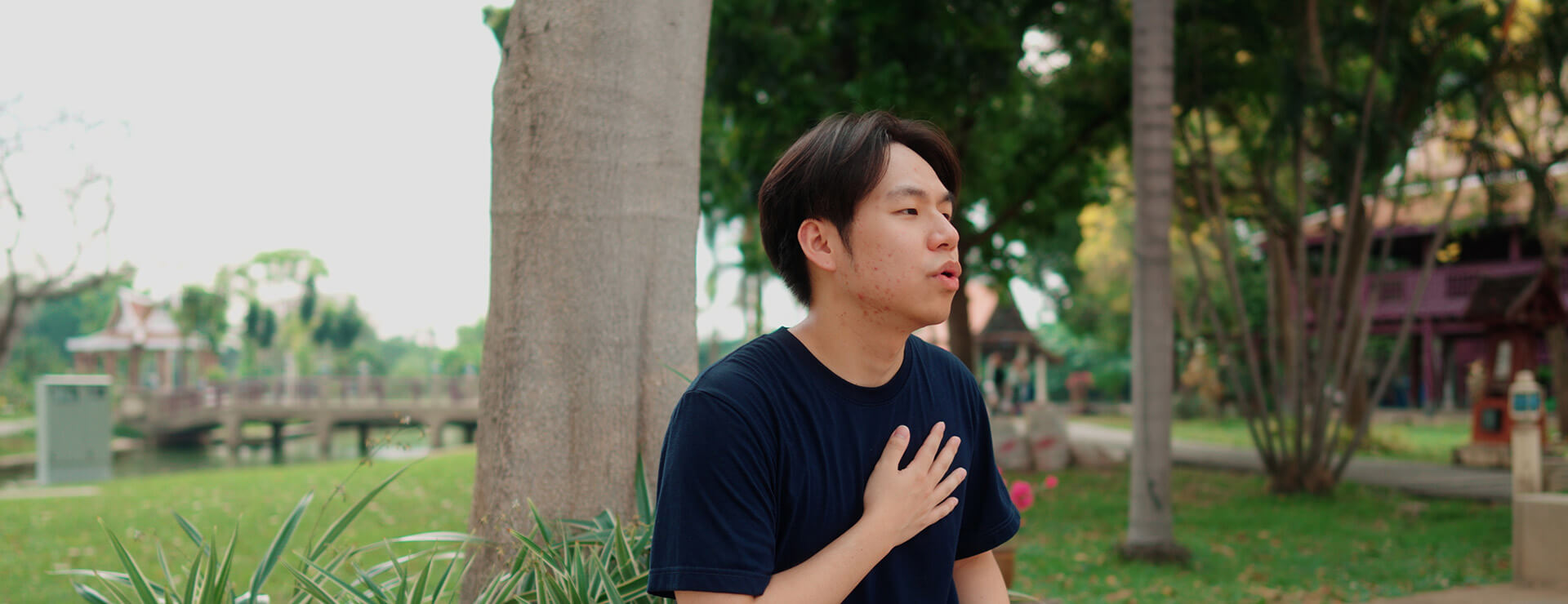 Young adult sitting to catch breath