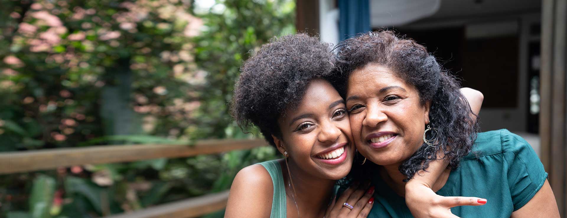 Mother and daughter smiling together