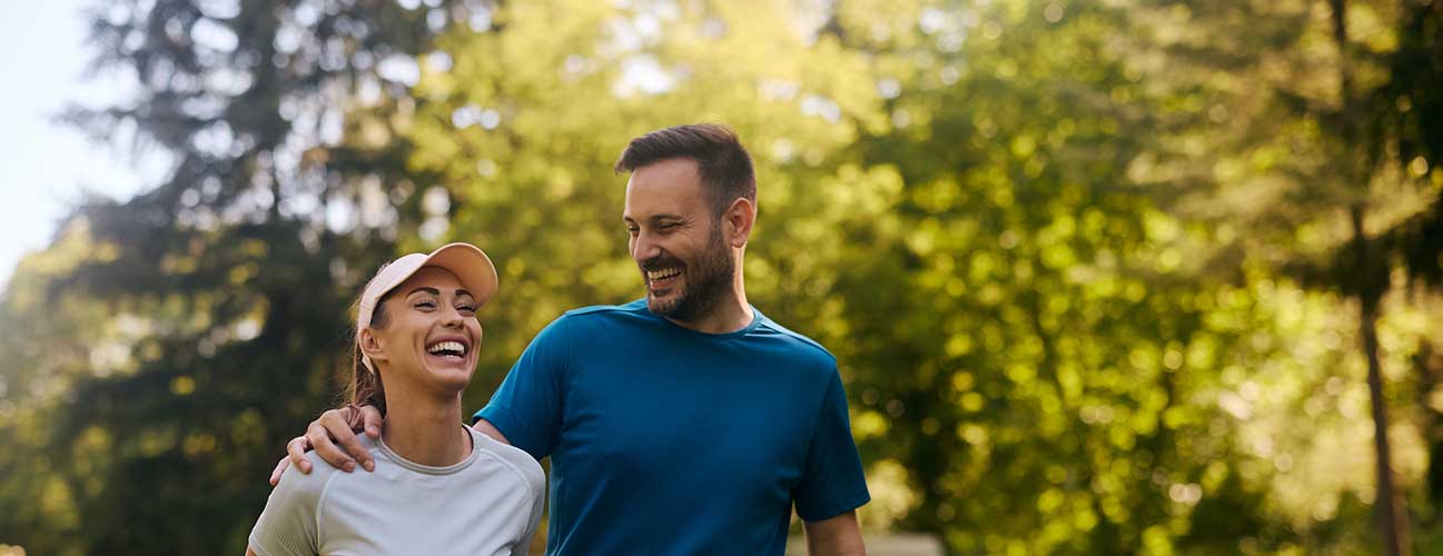 Couple hiking together on a sunny summer day