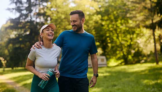 Couple hiking together on a sunny summer day