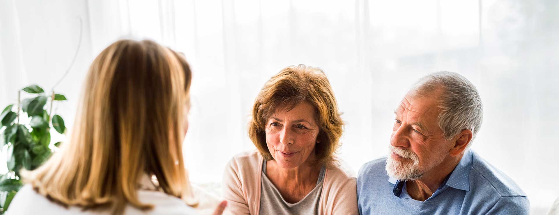 Couple discussing Parkinson's diagnosis with doctor
