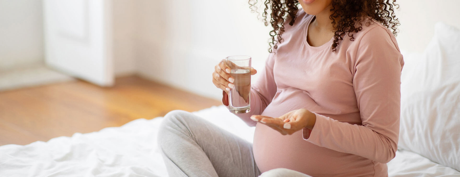 pregnant person takes pills