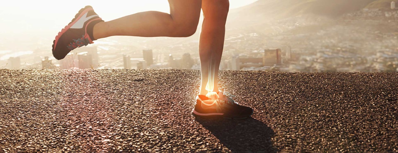 Runner on road with x-ray illustration of ankle in pain.