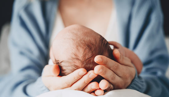Mother holding newborn baby