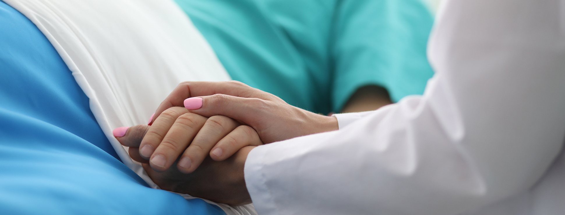 hipec surgery - doctor at bedside comforting patient by holding their hand