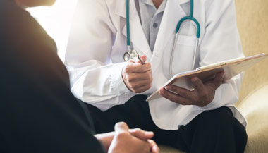 Man talking with doctor