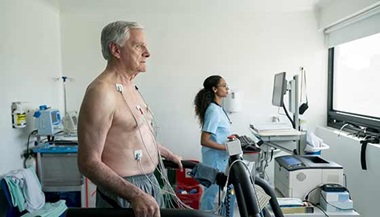 A senior man undergoes a stress echocardiogram.