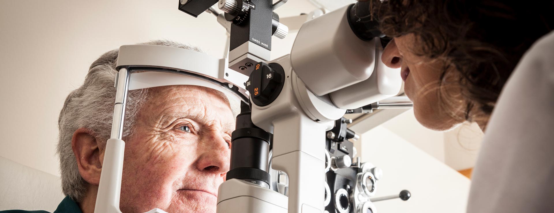 Older patient getting his eyes checked by the opthalmologist