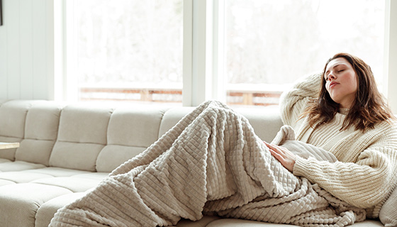 a woman curled up on the couch