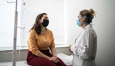 patient talks with her doctor