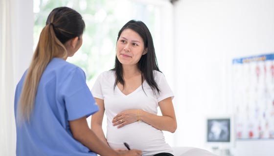 Expecting mother meeting with a doctor
