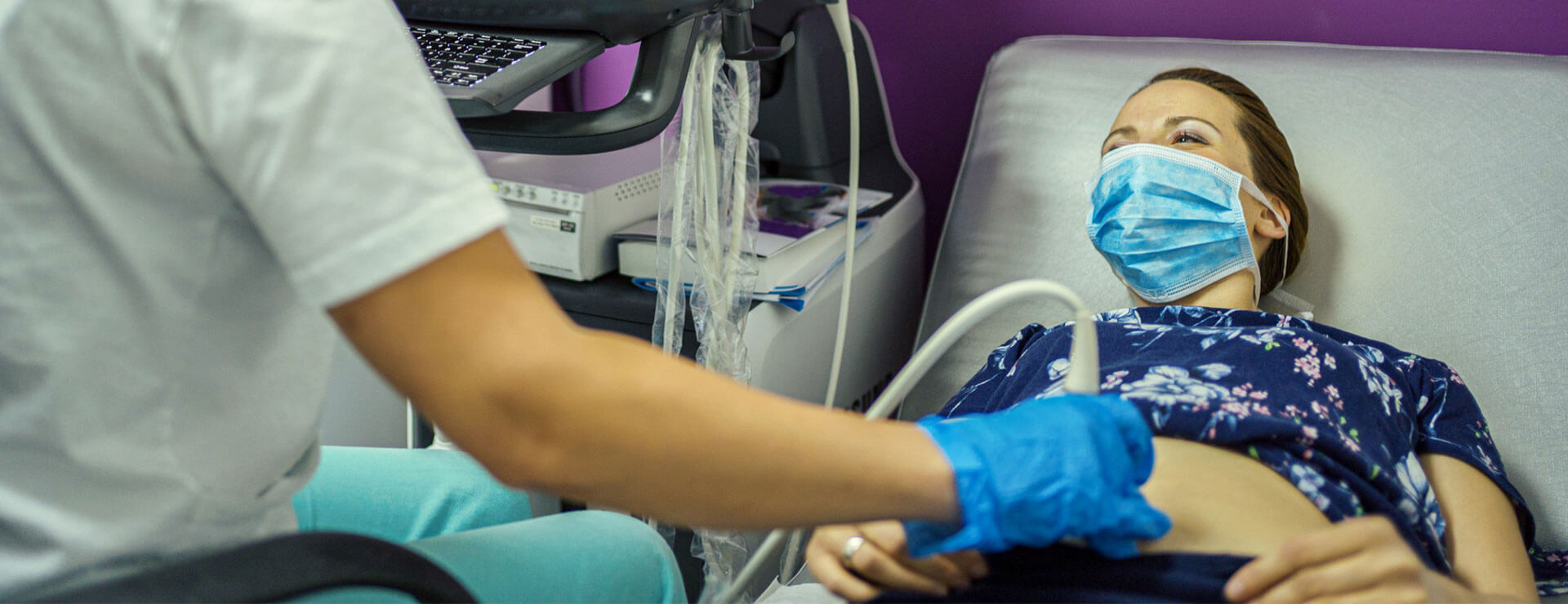 tech performs ultrasound on patient