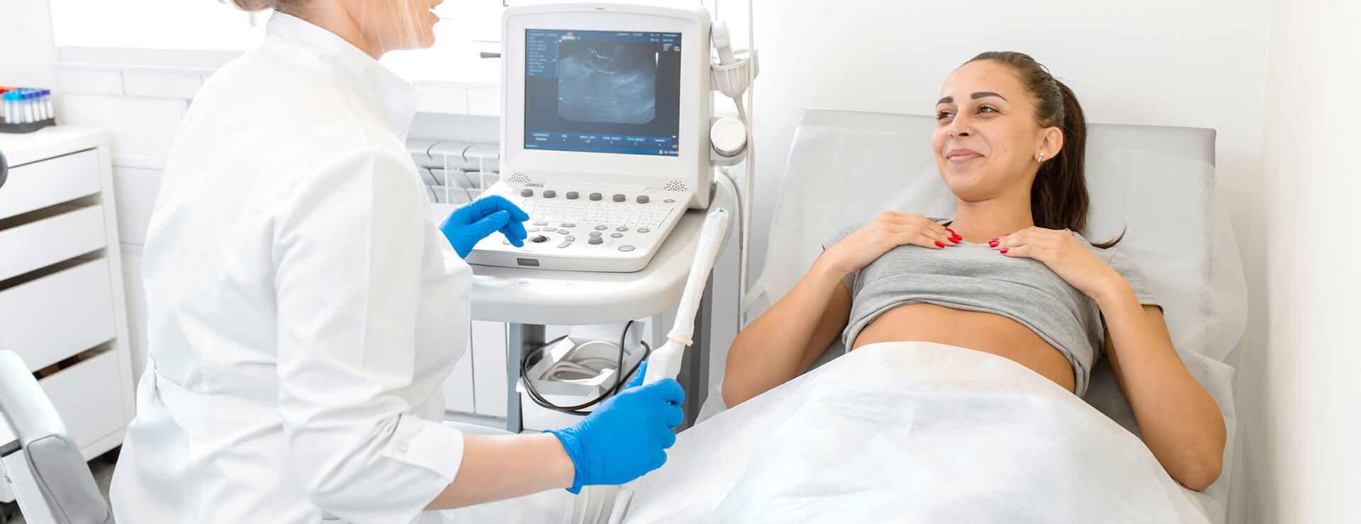 doctor shows patient ultrasound wand