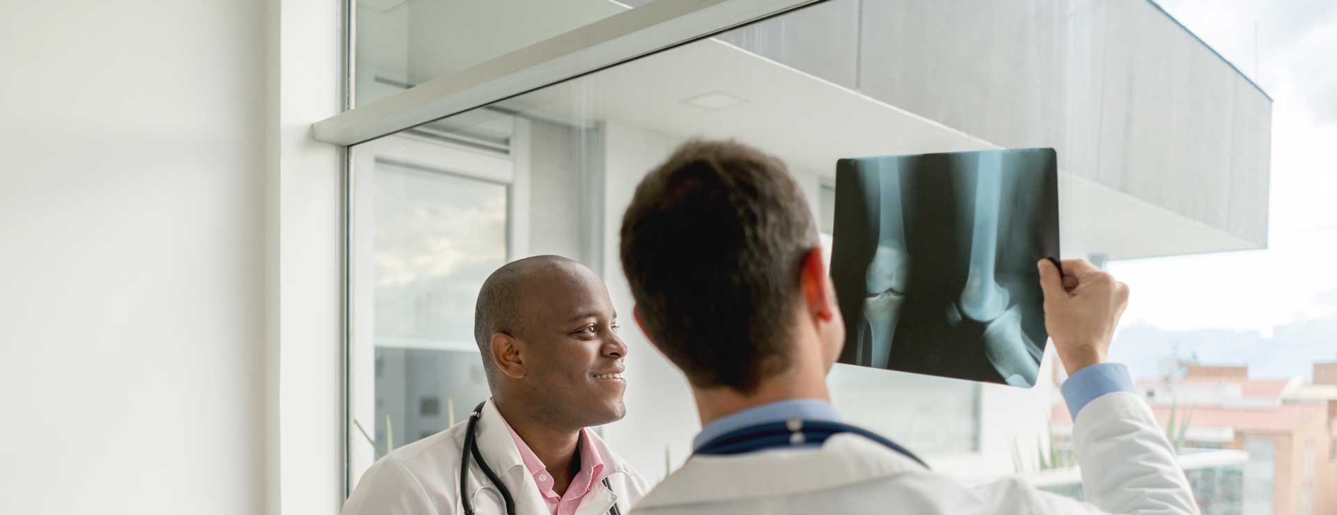 Two doctors reviewing an arthogrpahy