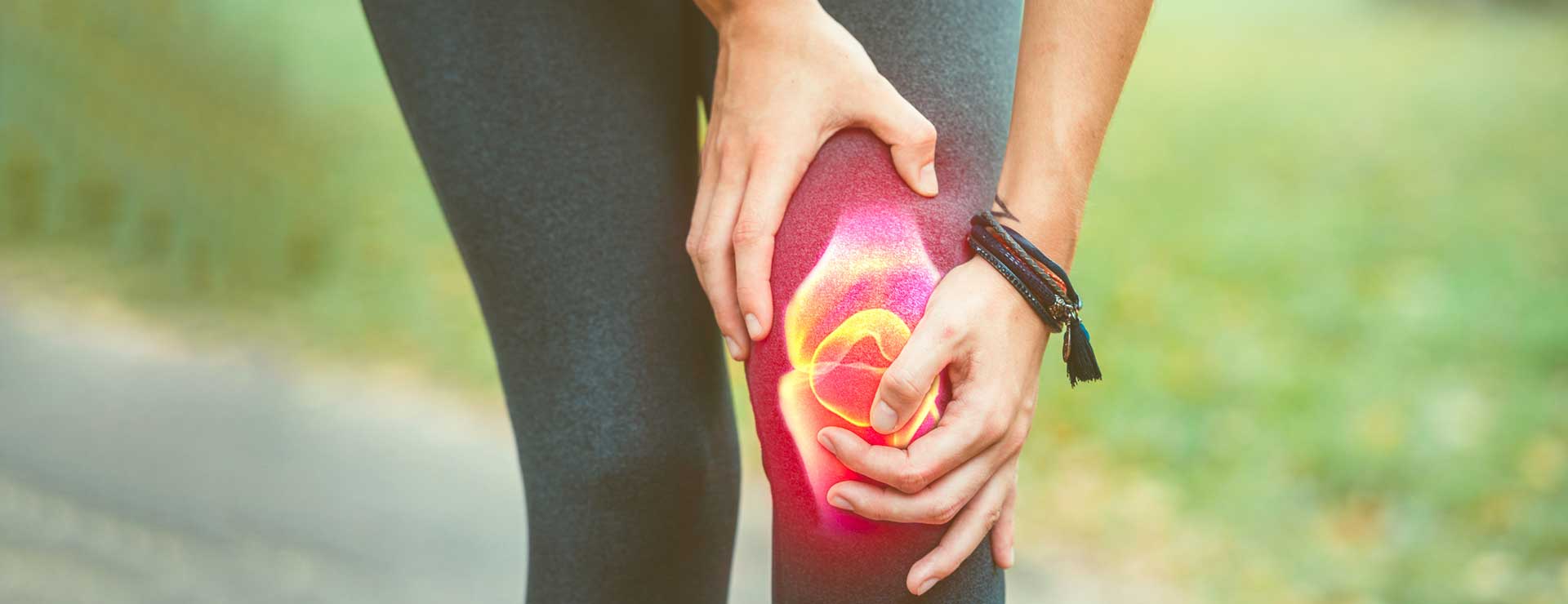 Woman holding her knee in pain