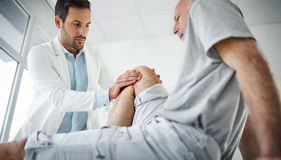 Doctor preparing for joint aspiration 