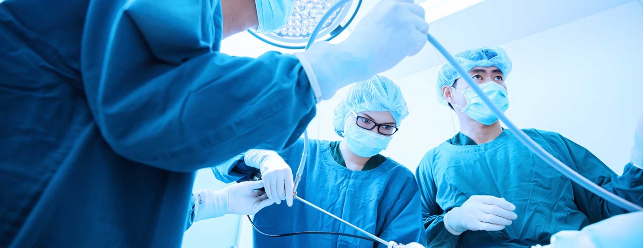 Surgeons performing a minimally invasive surgery