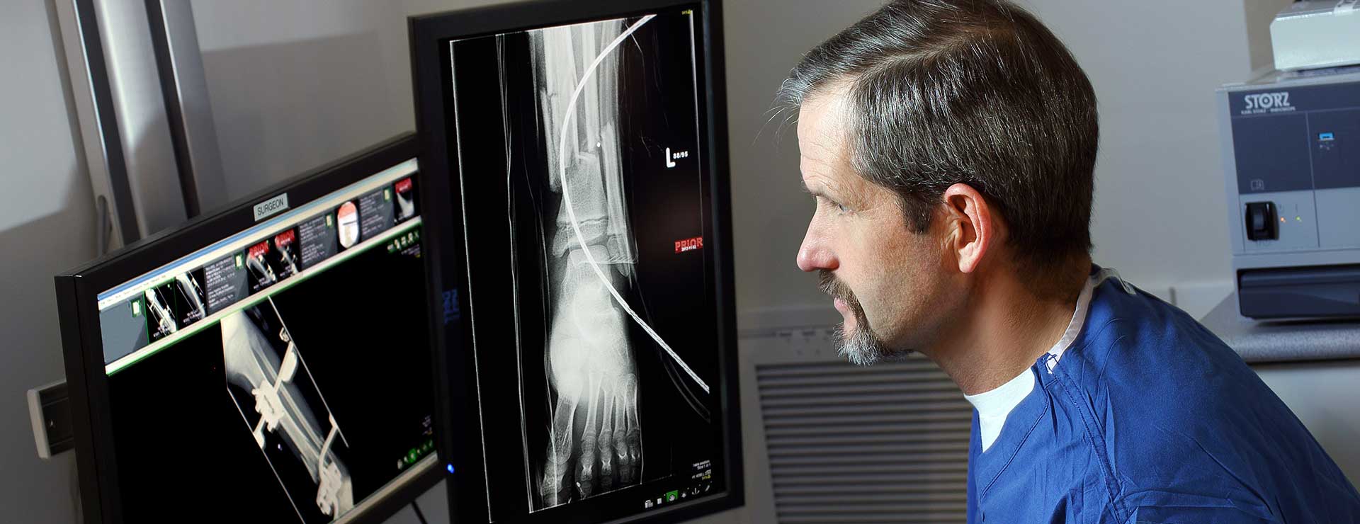 Dr. James Ficke looking at foot X-Rays before a surgery