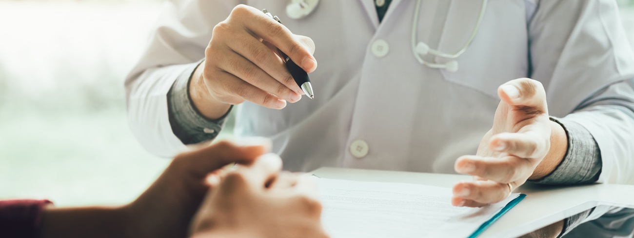 patient's hand in front of doctor