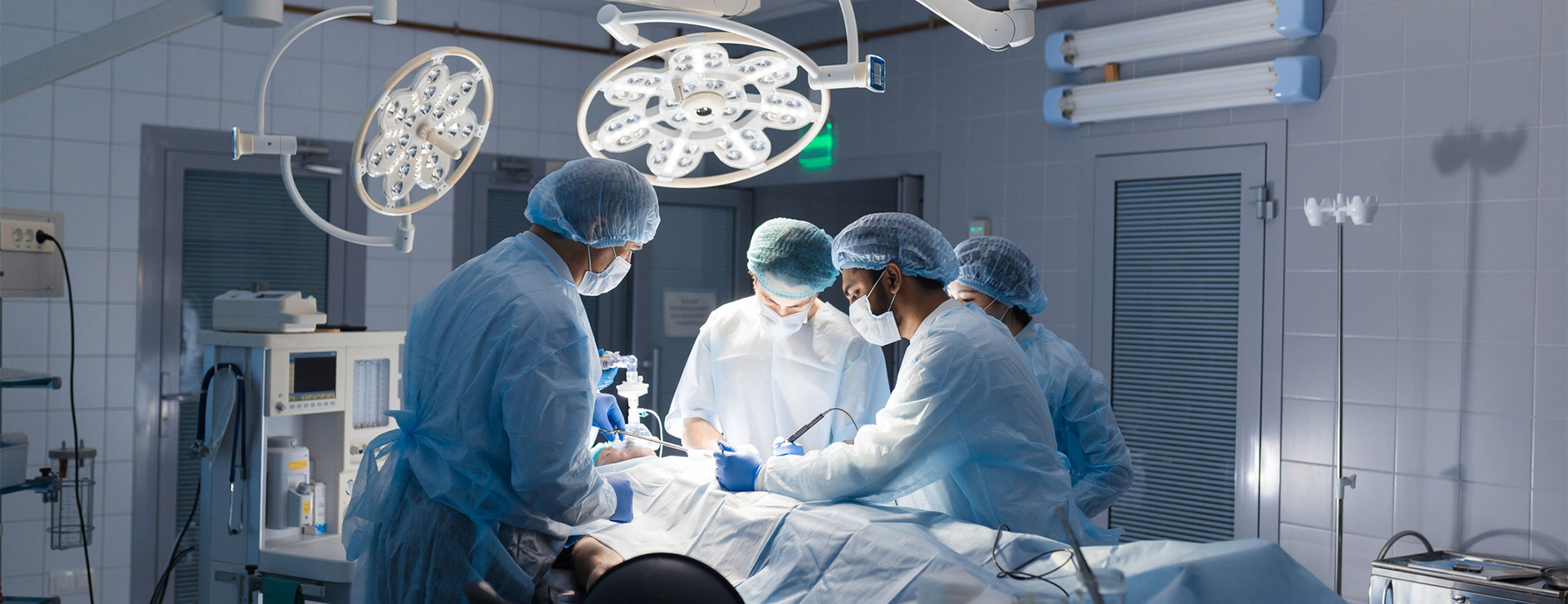Surgeon's performing a surgery. 