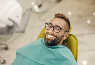 Man smiling with perfect teeth. 