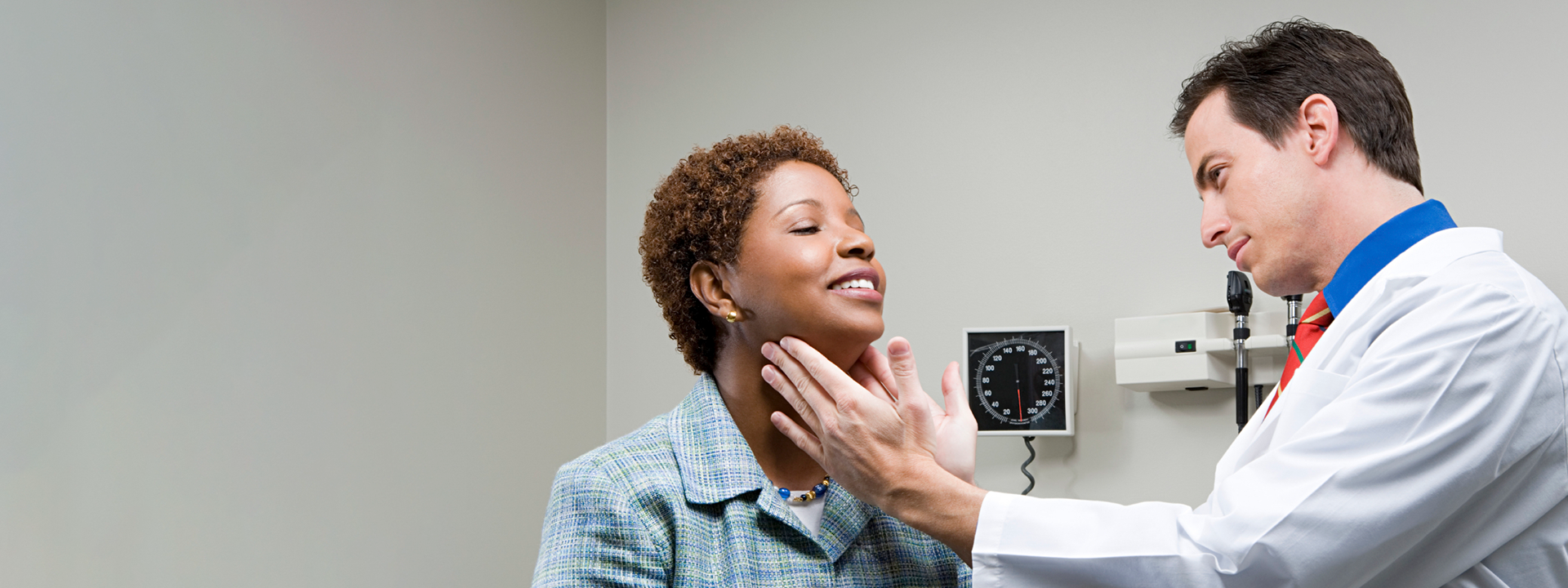 doctor checking patient's throat