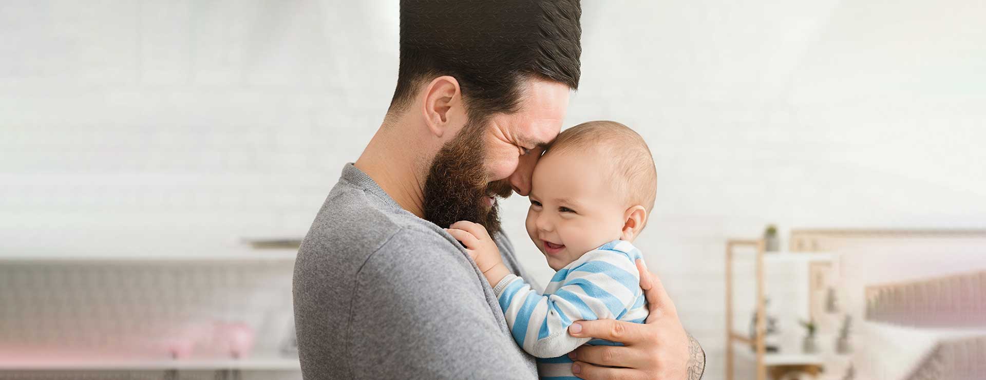 dad holding baby