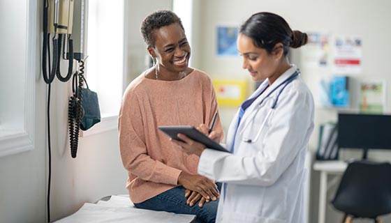 Surgeon discusses options with a patient