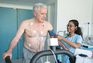 Older man getting heart tests done