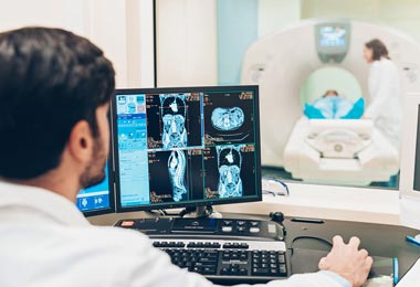 Radiologist reviewing patient scans