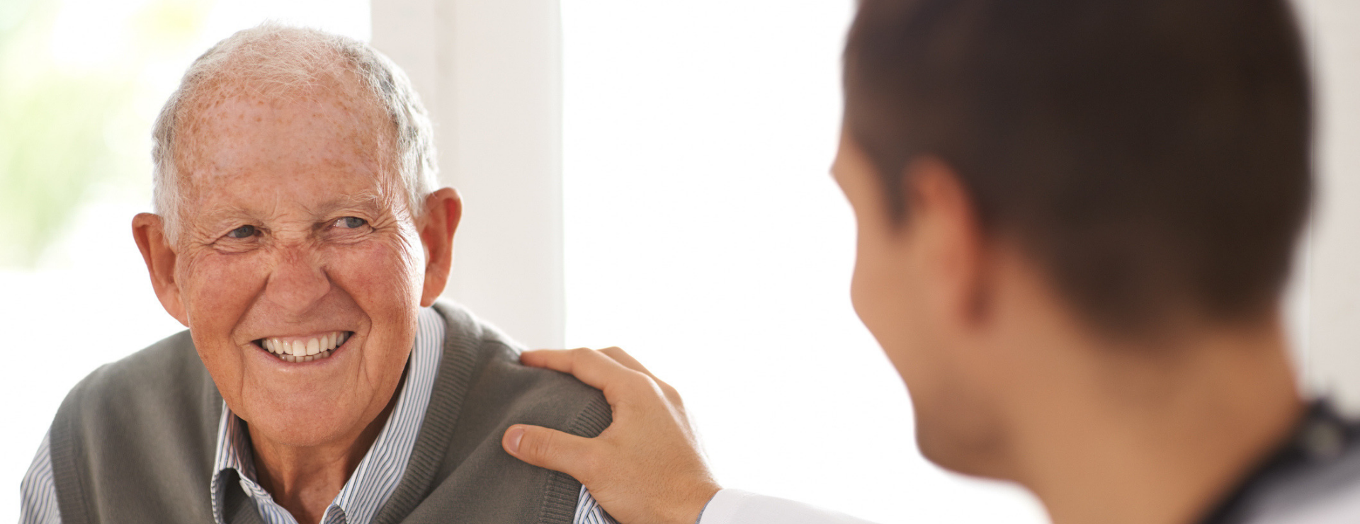 man speaking with doctor