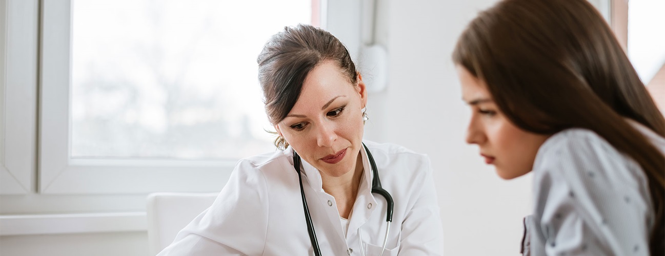 doctor consulting with female patient