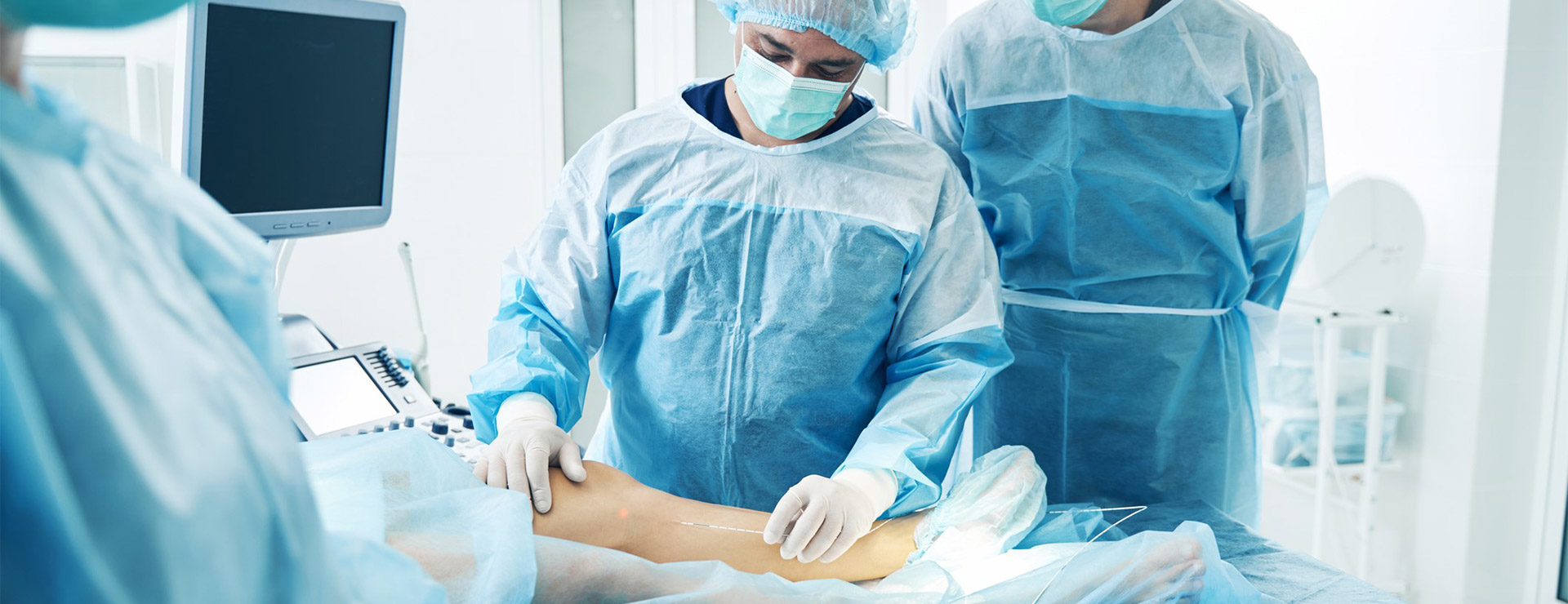 Doctors perfroming Endovenous Laser Varicose Vein Surgery.