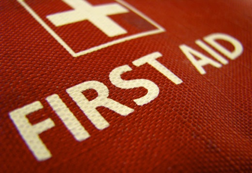 first aid sign printed on red canvas