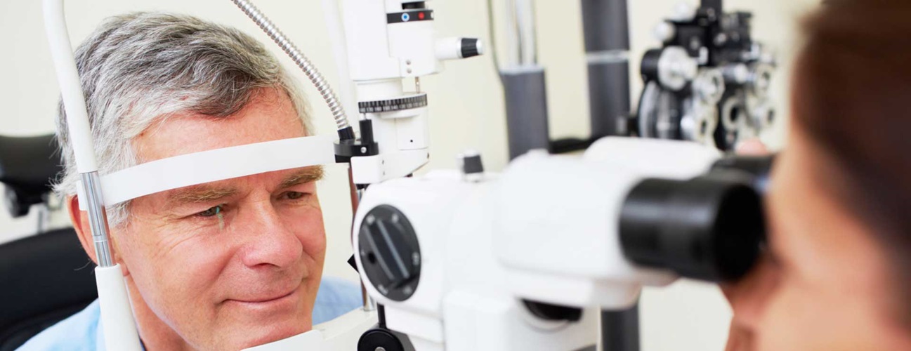 An older man having an eye exam