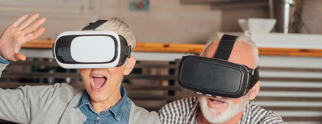 An old couple using virtual reality glasses