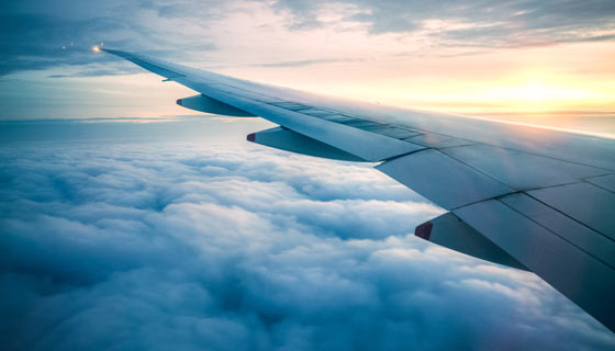 Airplane wing flying in the sky