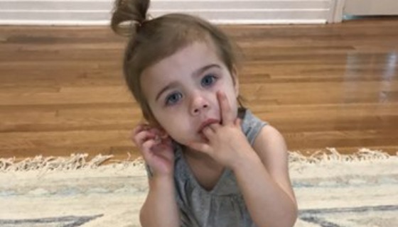 Toddler with fingers in mouth