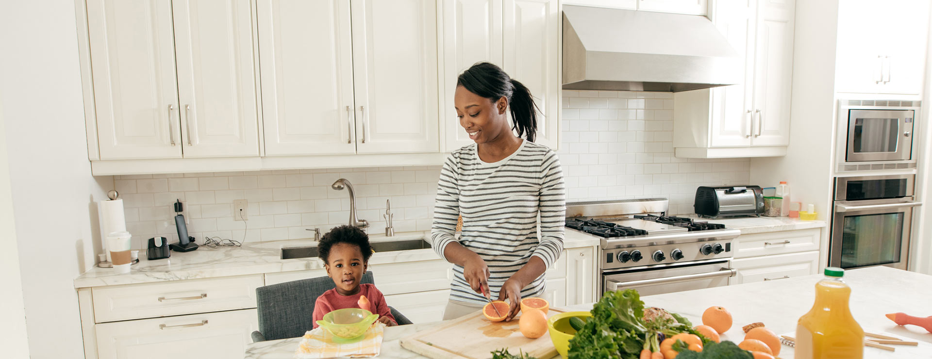 Mom and toddler in the kitchen together