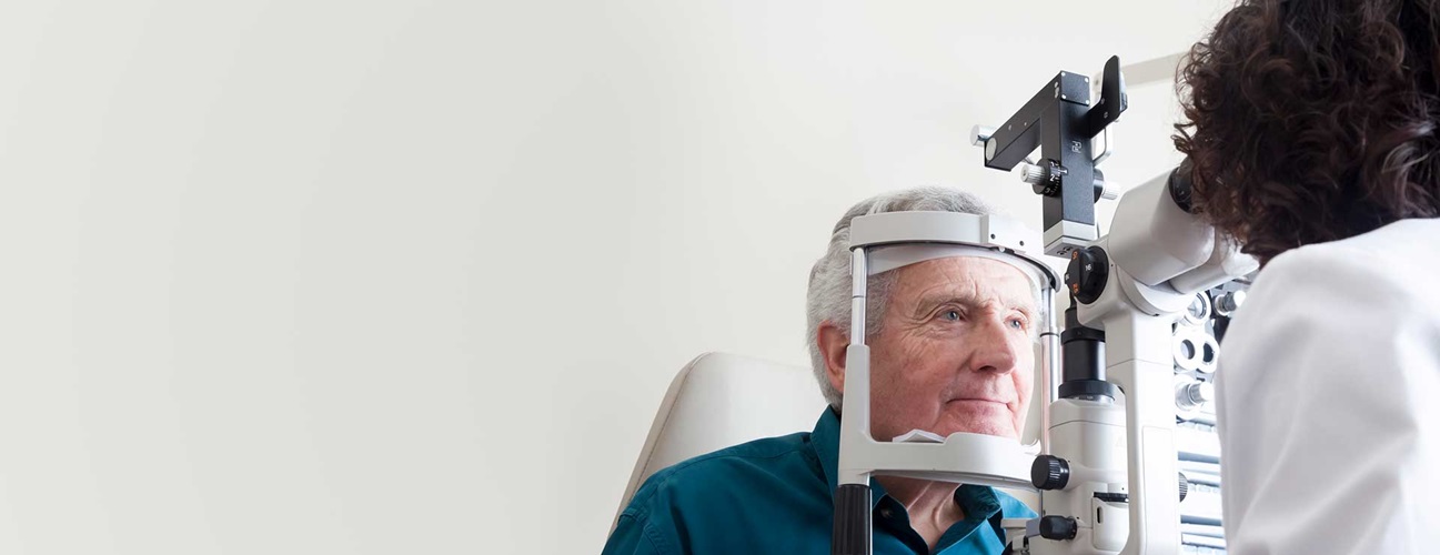 senior man receiving eye exam