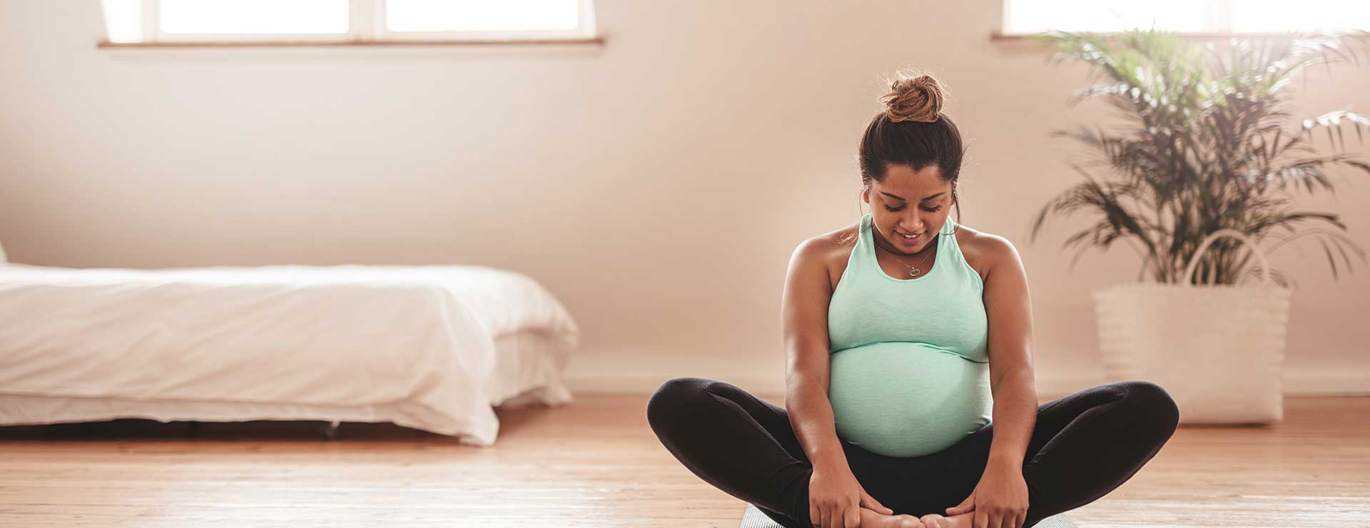 Pregnant Woman Sitting In A Lotus Pose Free Stock Photo and Image 164059610