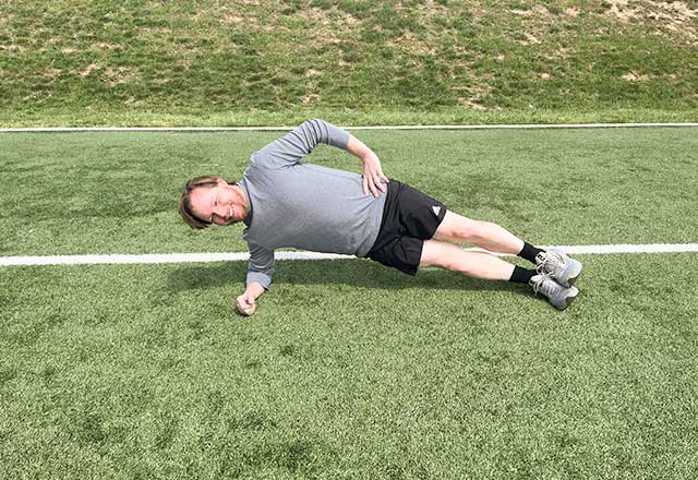 Image of Jimmy holding a side plank position.