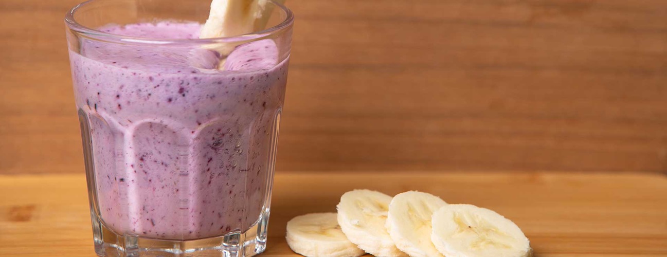glass of blueberry banana smoothie