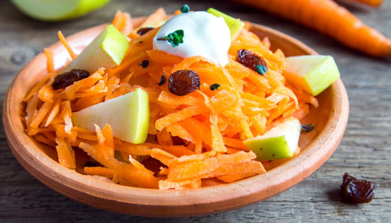 Healthy carrot salad with apple and raisins